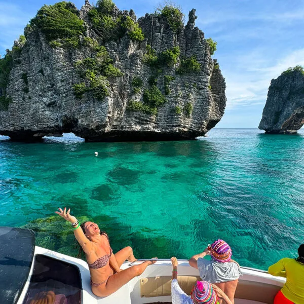 Woman in a bikini posing on a boat during the Early Bird Sunrise Tour to Koh Rok and Koh Haa from Phuket/Khao Lak