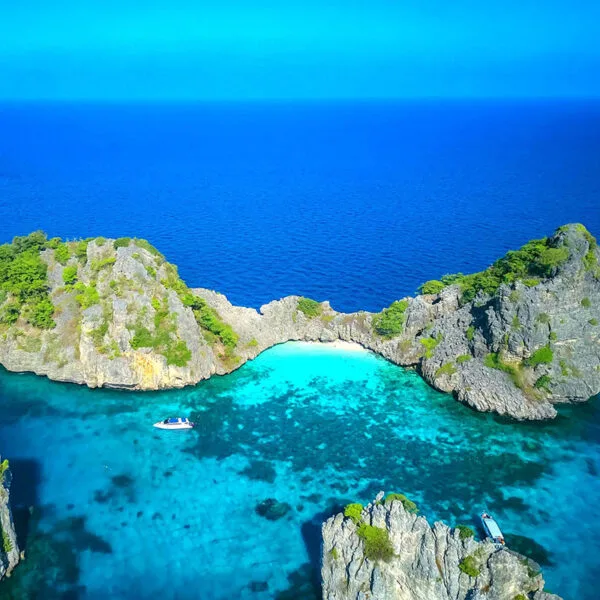 Aerial drone view of islands and crystal-clear waters during the Early Bird Sunrise Tour to Koh Rok and Koh Haa from Phuket/Khao Lak