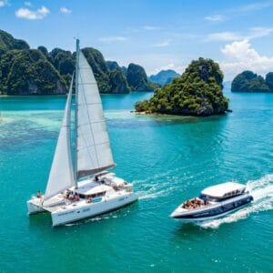 Sailing yacht and speedboat on the Andaman Sea near Phuket for island hopping